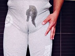 Chubby man pissing in pants and masturbating