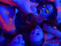 Covered with neon paint lovelies have group sex in blue light