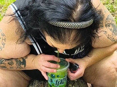 Sucking on a Straw in the Woods Squirting on Tree on Her Knees