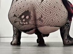 Crossdresser rides a dildo in all kinds of ways