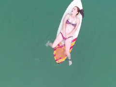 Sexy natural babe Penny Pax chilling on the surfboard