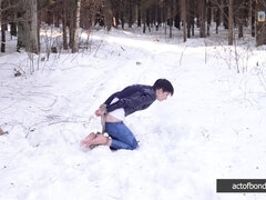 Barefoot Claudia is captured in the cold winter forest