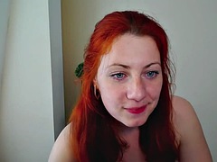 Solo chubby redhead babe with huge tits teases on webcam