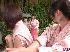 group of tiny Japanese honies sharing trouser snake in onsen