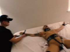 Gagged, strapped to a bed, Hitachi wand strapped to pussy, multiple orgasms
