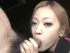 Japanese beauty deep-throats a gigantic rock-hard dong in the dark