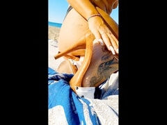 Milf flaunts her ass, feet, and sexy fetish boots on the beach in high high-heeled slippers