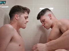 A manly athlete fucks a young boy bareback in the bathtub with a tight ass