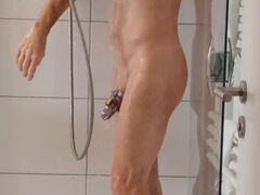 Gay slave locked in a cage takes a refreshing shower