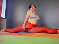 Regina Noir practices yoga in the gym wearing a seductive red yoga leotard