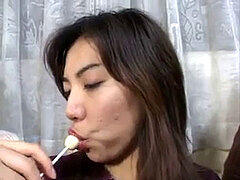 trio cute chinese femmes licking lollypops