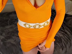 Big cock and big tits tranny Lucy jerks off and cums in an orange jersey dress