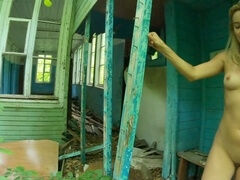 Seductive nymph explores an abandoned house in the nude