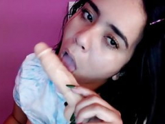 Latina throatfucks herself with a long dong