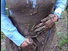 Sexy Crossdresser outside in a muddy mess. I masturbate my big cock and cum in mud, nylon pantyhose and leotard