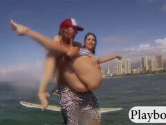 Women learning how to surf and have crab munching compete