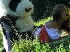 A guy in a panda suit is ramming a sexy brunette with his dick