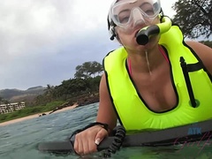 Adriana sees a turtle while snorkeling