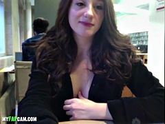 Showing off her big tits and using a dildo in public