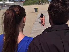 Scandalous whore walks naked in the street in front of people