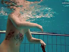 Hot tattooed babe Dasha with big tits spins underwater