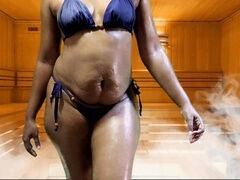 Nilmini Sheron showcases her sexy blue bathing suit in a steamy oil bath