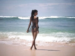 Cute Asian teen IyaQ shows off her godlike naked body on the beach