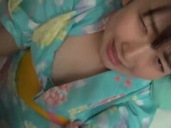 Beautiful cute girl wearing a yukata dress to sell at the hotel.