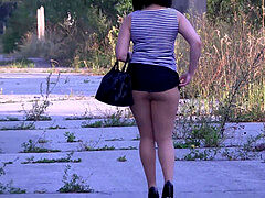 female walking with a backside-plug in the ass in nylon pantyhose