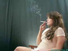Smoking hot MILF indulges in self-pleasure, seductive posing, and smoking