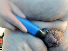 Molly shaves her genitals while sucking a dildo