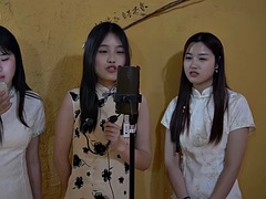 Three girls tied up singing