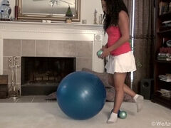 Divine plays on blue exercise ball and strips