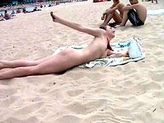 insatiable young nudists play with each other in sand
