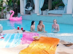 Three playful teens licking each other by the pool