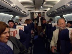 Pilot and a couple of sexy flight attendants fuck on the plane