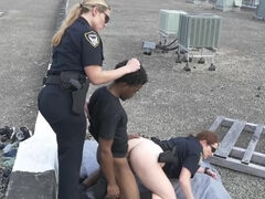 Two chubby female cops fucking with a black man on the roof