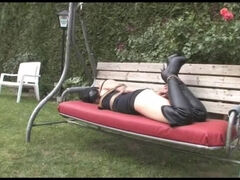 Iveta hogtied on the swinging couch