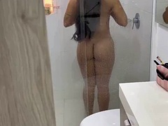 Latina is spied taking a shower and gets fucked after