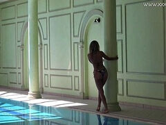 Russian porn star Mary Kalisy swims naked in the pool