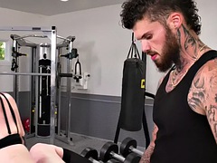 Tattooed tranny gets anal fucked in the gym by a tattooed bastard