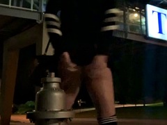 Riding a huge dildo on a fire hydrant next to a busy 4 lane road