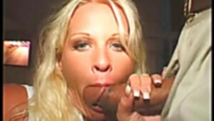 Horny blonde gets her mouth pounded with guy's huge hard-on