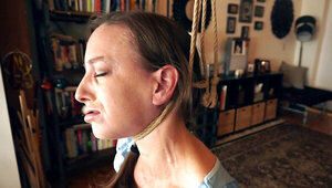 Solo masturbation scene showing a choking solo slut