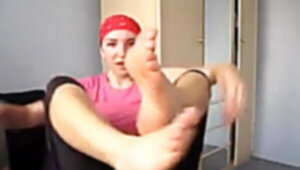 Girl works out and smells her stinky feet.