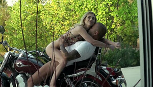 Inked blonde with a nice ass gets fucked on the motorbike