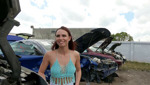Attractive brunette riding a young stud in the car