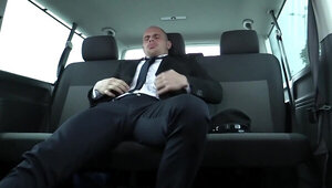 Secretary brunette blows a man and rides him in the car