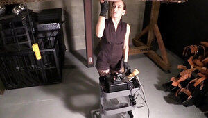 Slave in the cage is being milked by a perverted mistress