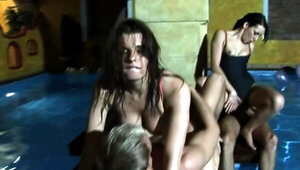 Horny girls are having an orgy in the pool with some men here